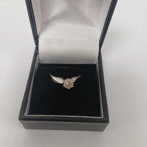 PLATINUM SOLITAIRE RING SET WITH A NATURAL DIAMOND