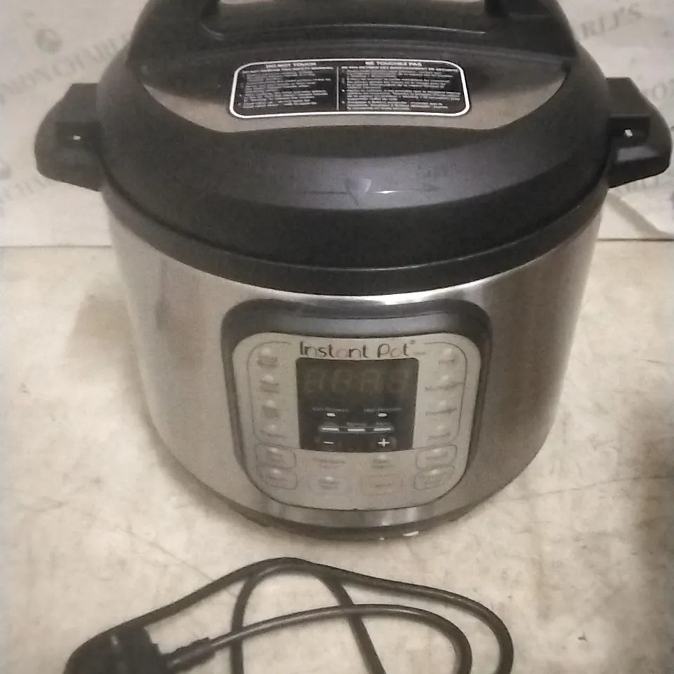 BOXED INSTANT POT  MULTI USE PRESSURE COOKER 