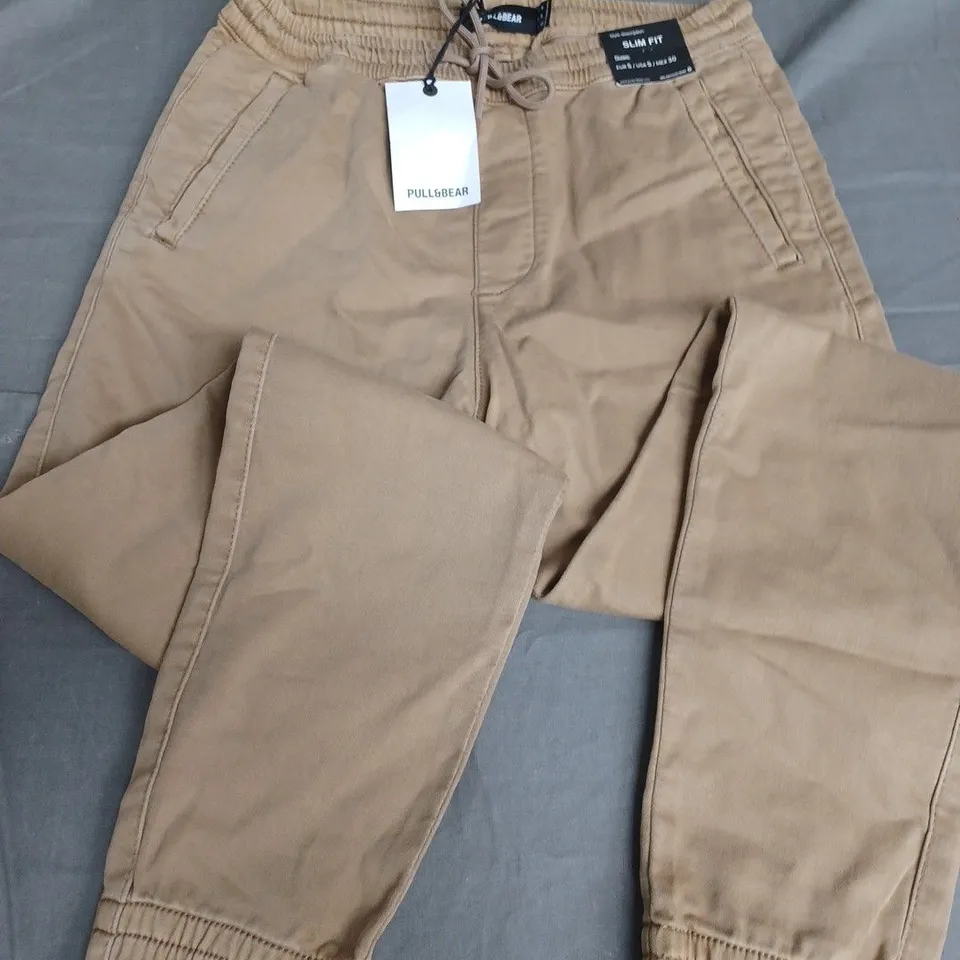 PULL & BEAR SLIM FIT CUFFED TROUSERS IN BROWN - EUR S