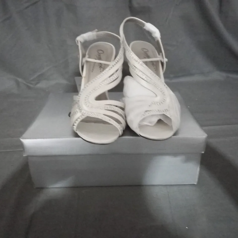 APPROXIMATELY 12 BOXED PAIR OF CASANDRA IVORY HEELED SANDALS IN VARIOUS SIZES TO INCLUDE SIZE 5