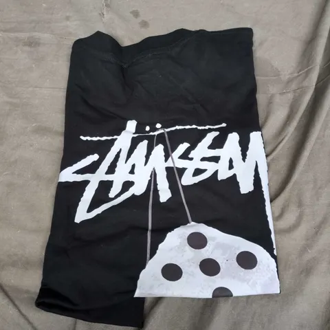 BLACK GRAPHIC T-SHIRT WITH WHITE LOGO AND DICE MOTIF STUSSY