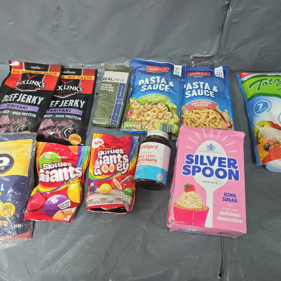 APPROXIMATELY 10 ASSORTED FOOD ITEMS TO INCLUDE SKITTLES, REALMEAL BAR, AND BEEF JERKY ETC. 