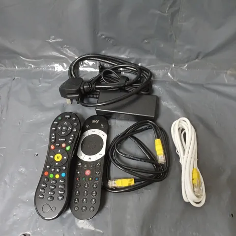 BOX OF APPROXIMATELY 20 ASSORTED ELECTRICAL ITEMS TO INCLUDE CABLES, REMOTE CONTROLS AND PLUGS