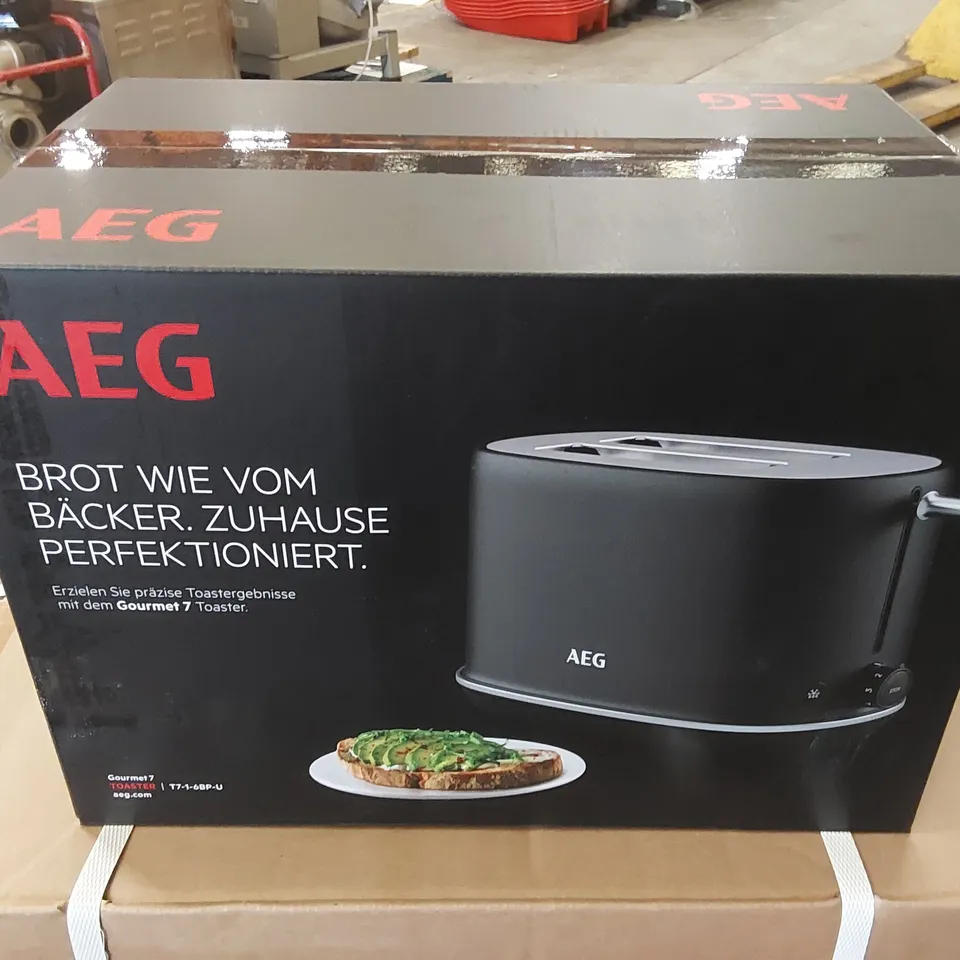 BRAND NEW BOXED AEG GOURMET 7 TOASTER 2 SLOT T7-1-6BP-U, 7 BROWNING LEVELS, DEFROST FUNCTION, REHEAT FUNCTION, INCLUDES WARMING RACK, LIFT-AND-LOOK FUNCTION, TOASTING WITH PRECISION GRAPHITE GREY