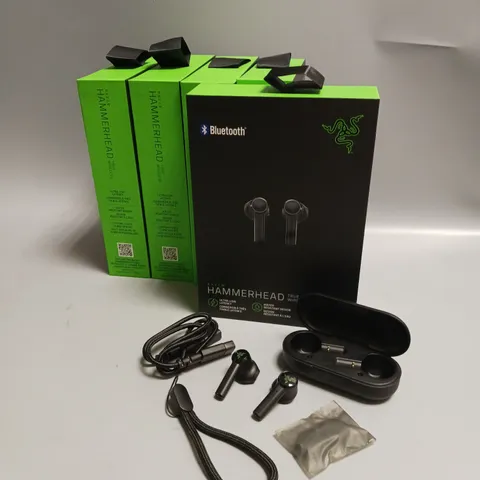LOT OF 5 BOXED RAZER WIRELESS HEADPHONES IN BLACK AND GREEN INCLUDES CHARGING CASE, CABLE AND WRIST STRAP