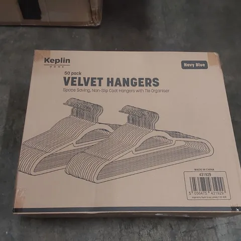 BOX OF APPROXIMATELY 50 KEPLIN BLACK VELVET CLOTHES HANGERS 