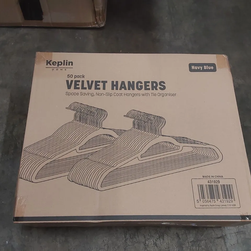 BOX OF APPROXIMATELY 50 KEPLIN BLACK VELVET CLOTHES HANGERS 