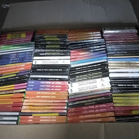 APPROXIMATELY 100 ASSORTED CDS AND DVDS TO INCLUDE NOW MUSIC 18, NOW YEARBOOK, AND NOW THAT'S WHAT I CALL ETC.
