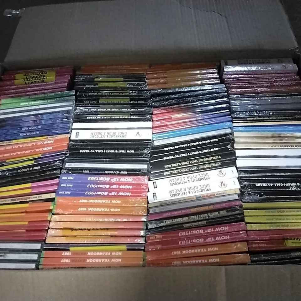 APPROXIMATELY 100 ASSORTED CDS AND DVDS TO INCLUDE NOW MUSIC 18, NOW YEARBOOK, AND NOW THAT'S WHAT I CALL ETC. 