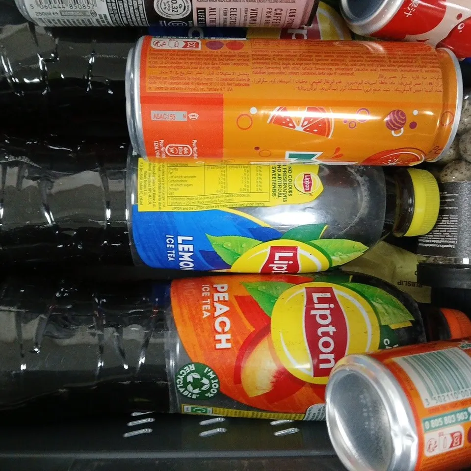 APPROXIMATELY 10 ASSORTED FOOD AND DRINK ITEMS TO INCLUDE LIPTON ICE TEA, REIGN, FANTA, ETC