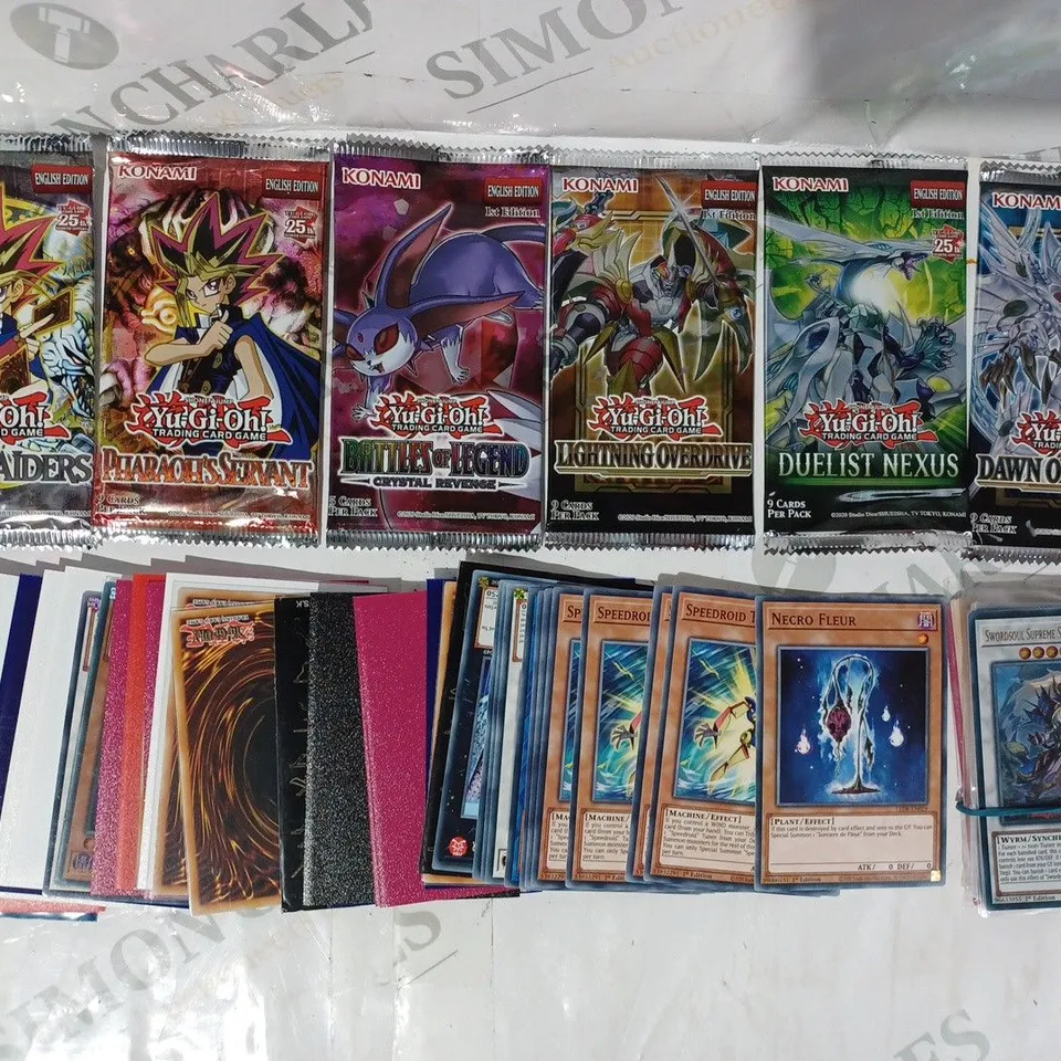 ASSORTMENT OF YU-GI-OH TRADING CARDS AND BOOSTER PACKS