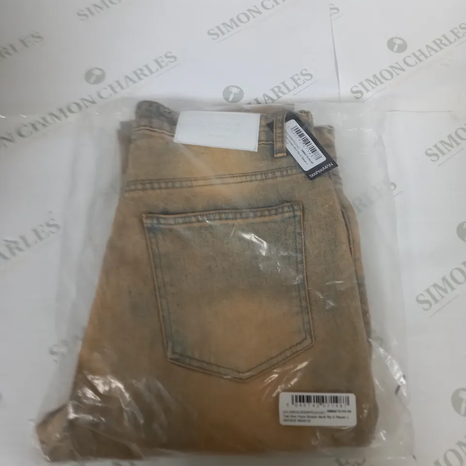 BAGGED BOOHOO MAN FLARE STRETCH RIP JEANS SIZE 32