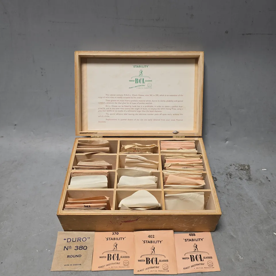 CABINET CONTAINING APPROXIMATELY 20 BCL LOW DOME WATCH PLASTIC GLASSES SIZES UNSPECIFIED 