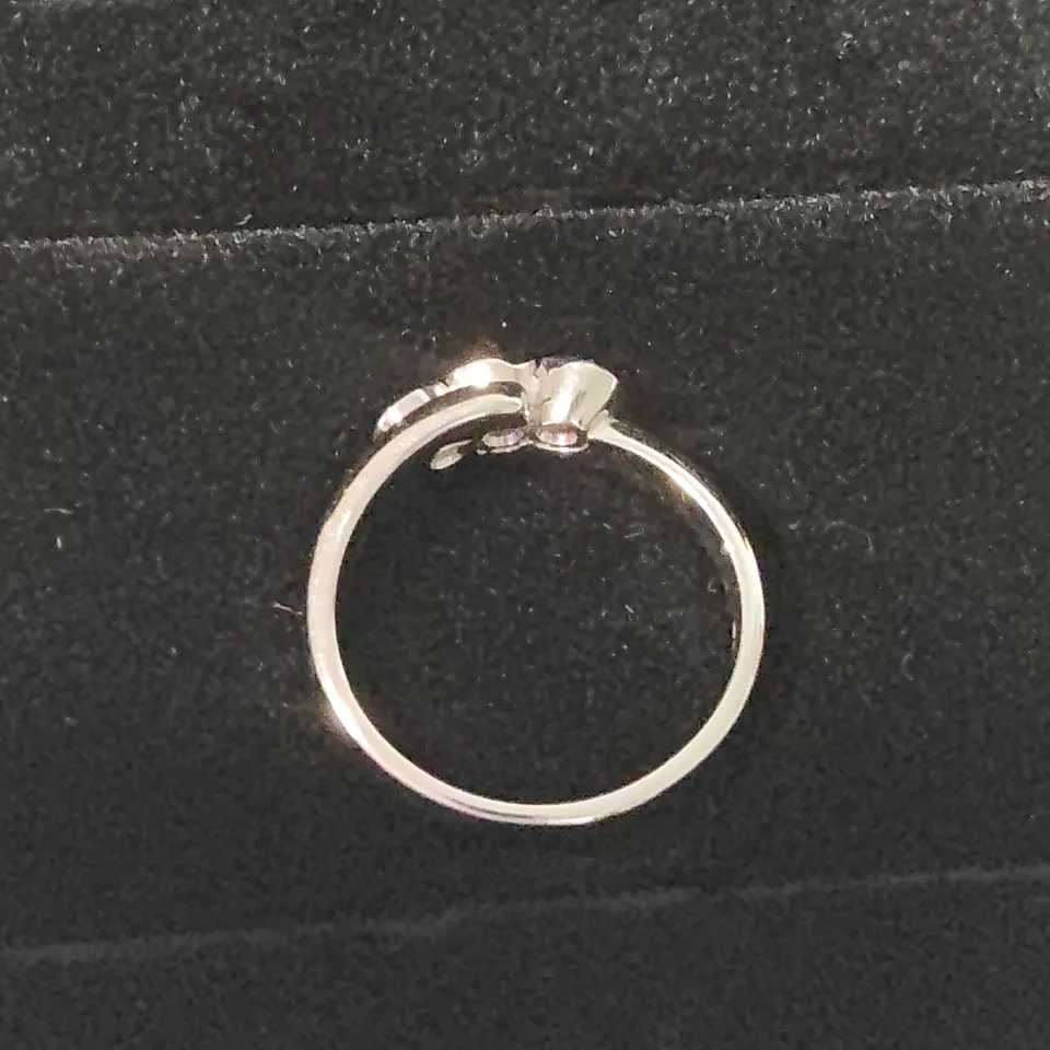 18CT WHITE GOLD THREE STONE RING SET WITH A NATURAL DIAMONDS WEIGHING +-0.42CT