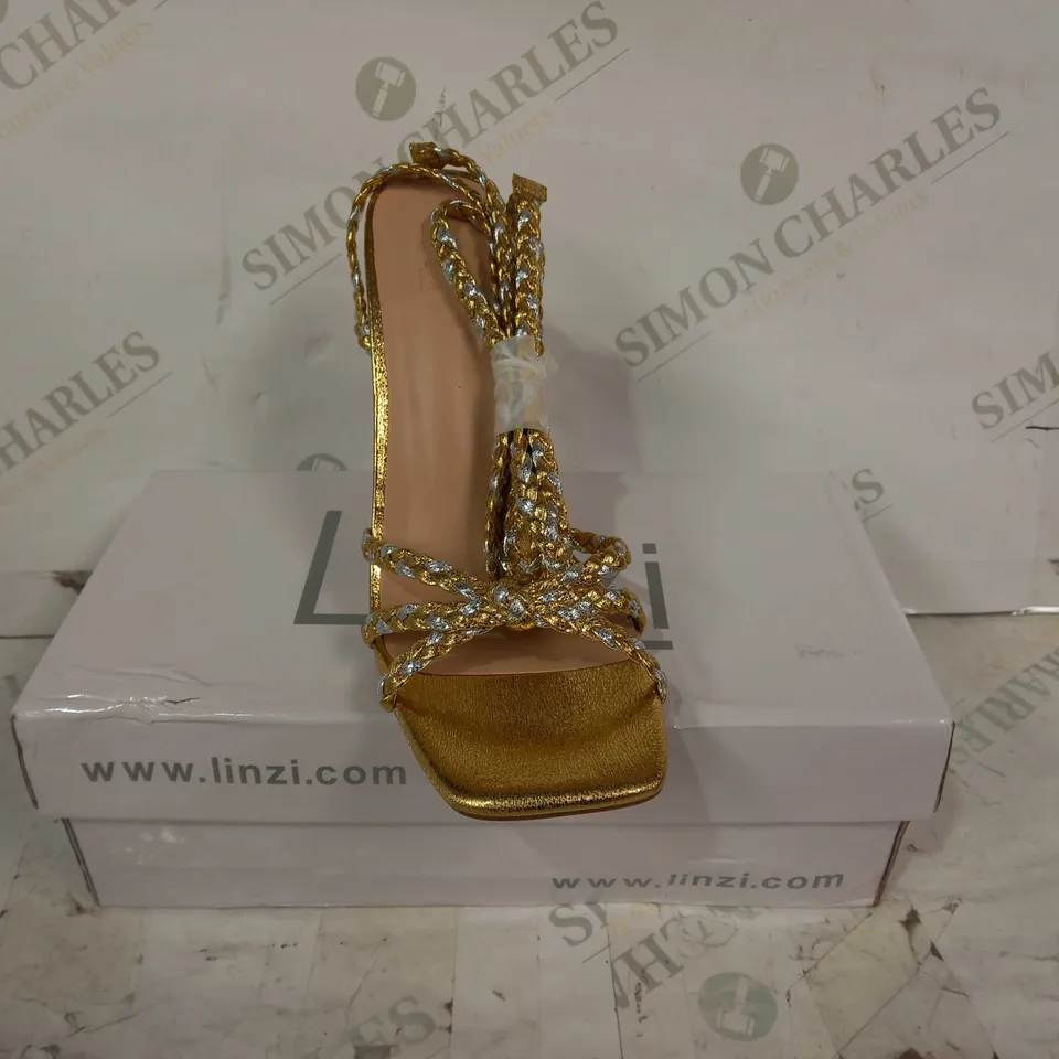 BOXED PAIR OF LINZI OPEN TOE WOVEN STRAPPY HIGH HEEL SANDALS IN METALLIC GOLD COLOUR SIZE 5