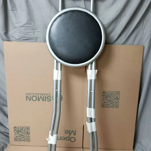 METAL-FRAMED ROUND-SEAT STOOL WITH BLACK PADDED CUSHION