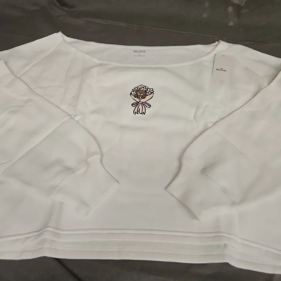 HOLLISTER SLOUCH SHOULDER BEAR/FLOWERS CROP JUMPER, WHITE - UK SIZE MEDIUM