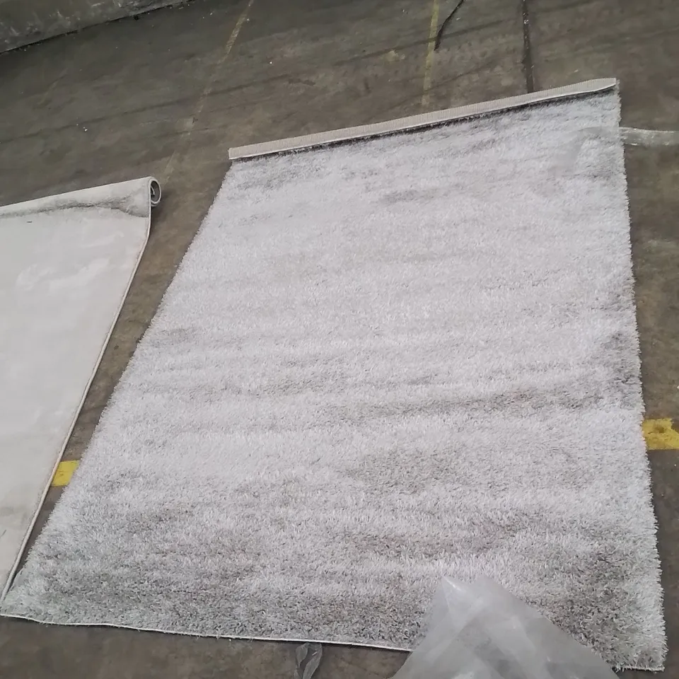 STILLAGE OF APPROXIMATELY 20 BAGGED QUALITY DESIGNER RUGS