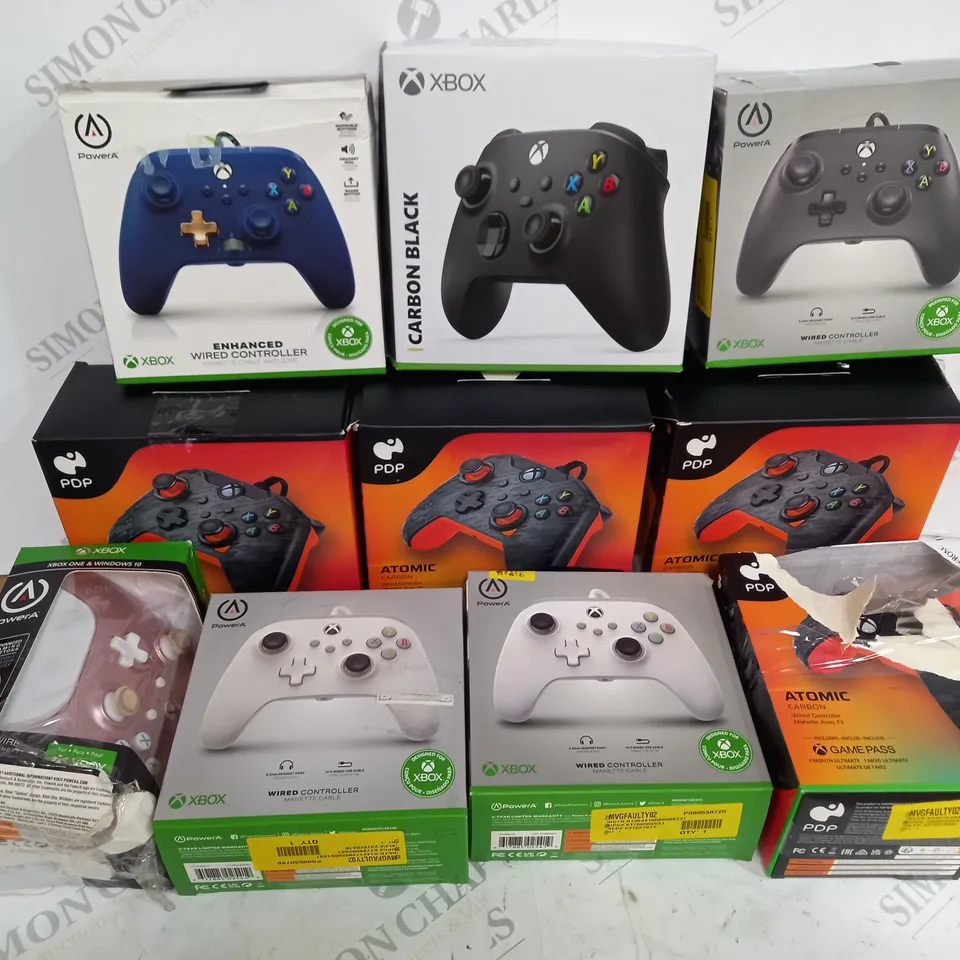 ASSORTMENT OF BOXED XBOX CONTROLLERS INCLUDING FOUR PDP ATOMIC CARBON WIRED CONTROLLERS