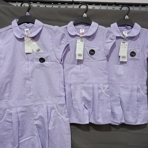BOX OF APPROXIMATELY 250 GIRLS SCHOOL GINGHAM PURPLE PLAYSUITS IN VARIOUS SIZES - COLLECTION ONLY