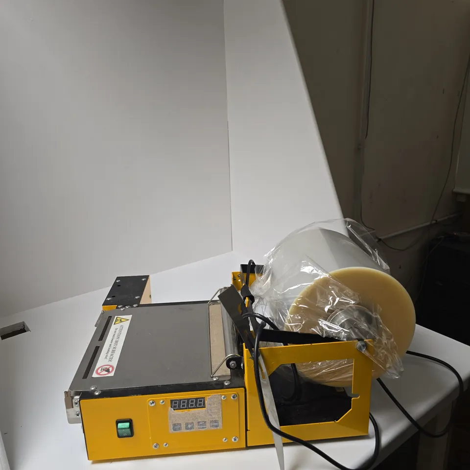 DESK TOP YELLOW PACKAGING/SEALING MACHINE WITH ROLLER