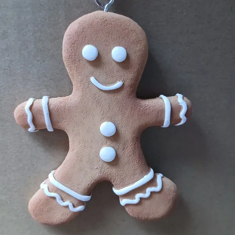 APPROXIMATELY 36 SETS OF THREE HANGING GINGER BREAD FAMILY ORNAMENTS