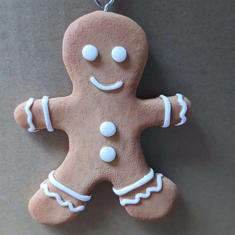 APPROXIMATELY 36 SETS OF THREE HANGING GINGER BREAD FAMILY ORNAMENTS