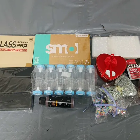 APPROXIMATELY 10 ASSORTED HOUSEHOLD ITEMS TO INCLUDE - SCREEN PROTECTOR, SMOL LAUNDRY CAPSULES, AND CHAIR LEG FLOOR PROTECTORS ETC. 