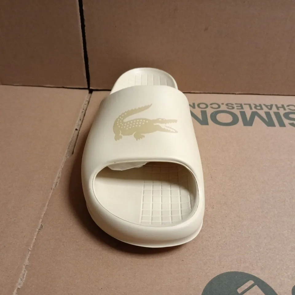 PAIR OF LACOSTE SERVE SLIDES IN CREAM SIZE UK 5