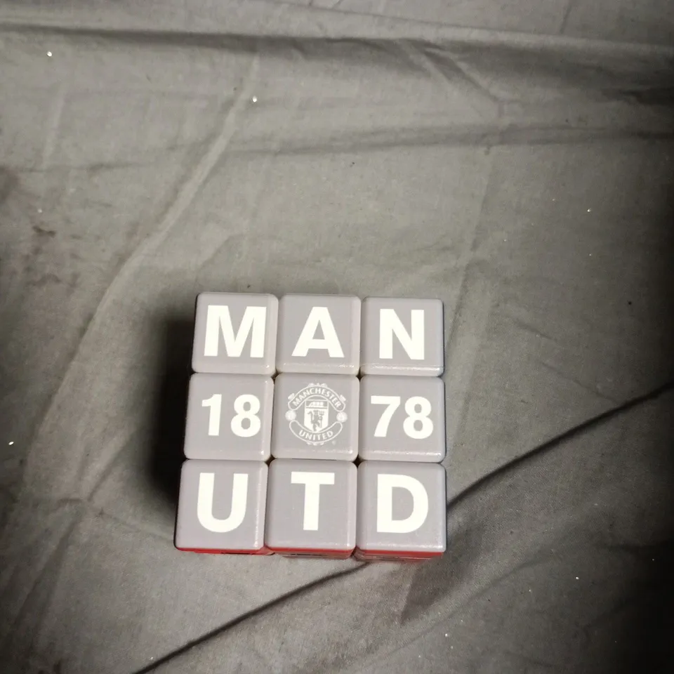 BOX OF APPROXIMATELY 10 ASSORTED TOYS INCLUDING ORIGAMI , DRGONBALL FIGURE AND MAN UNITED RUBIKS CUBE 