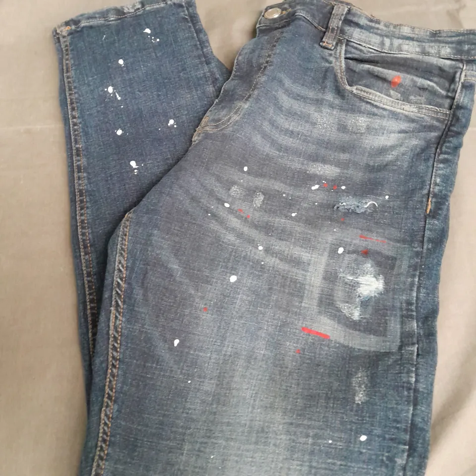 SUPPLY & DEMAND RIPPED JEANS IN NAVY WITH PAINT SPLATTERS - 36W - XL