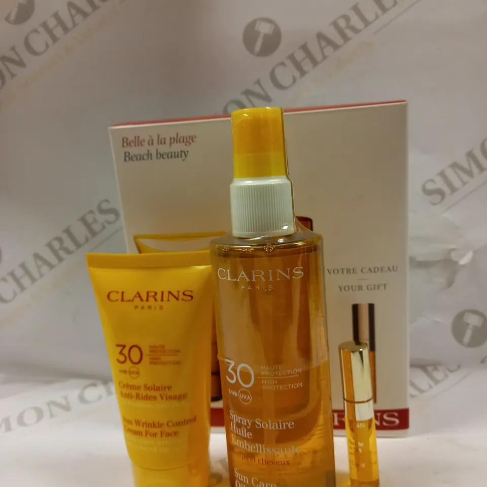 CLARINS BEACH BEAUTY KIT: SUN WRINKLE CONTROL CREAM FOR FACE 30 UVB/UVA 75ML+SUN CARE CREAM 20 UVB/UVA 200ML+LIP COMFORT OIL 2.8ML 3PCS