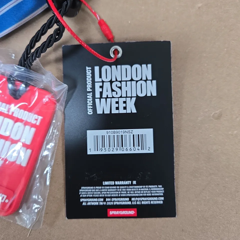 SPRAYGROUND LONDON FASHION WEEK BACKPACK – MULTICOLOURED GRAPHIC DESIGN WITH TAGS