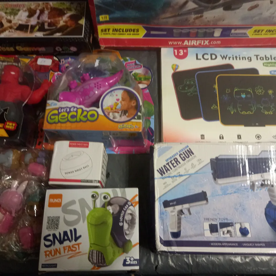 LOT OF APPROXIMATELY 12 ASSORTED TOYS AND GAMES TO INCLUDE ELECTRIC WATER GUN, LCD WRITING TABLET AND LETS GO GECKO