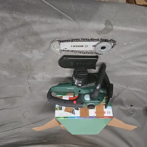 Bosch handheld power tool – green with black handle.