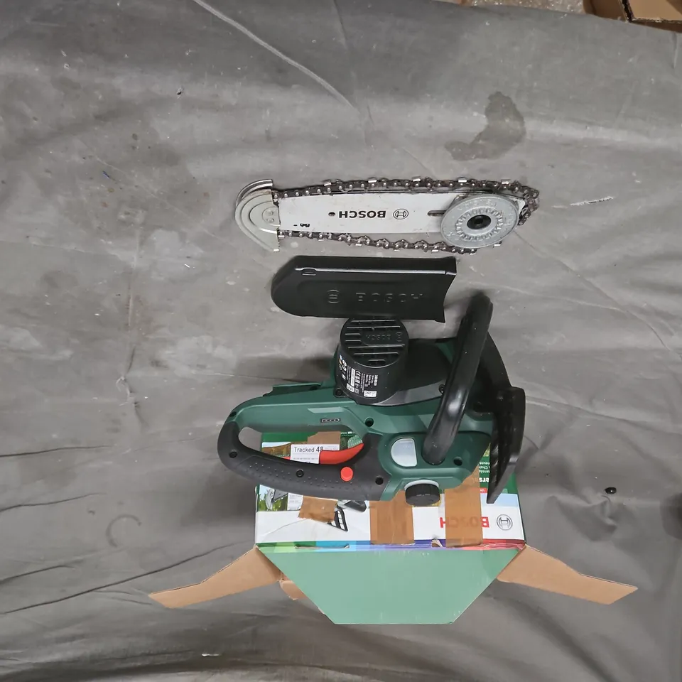 Bosch handheld power tool – green with black handle.