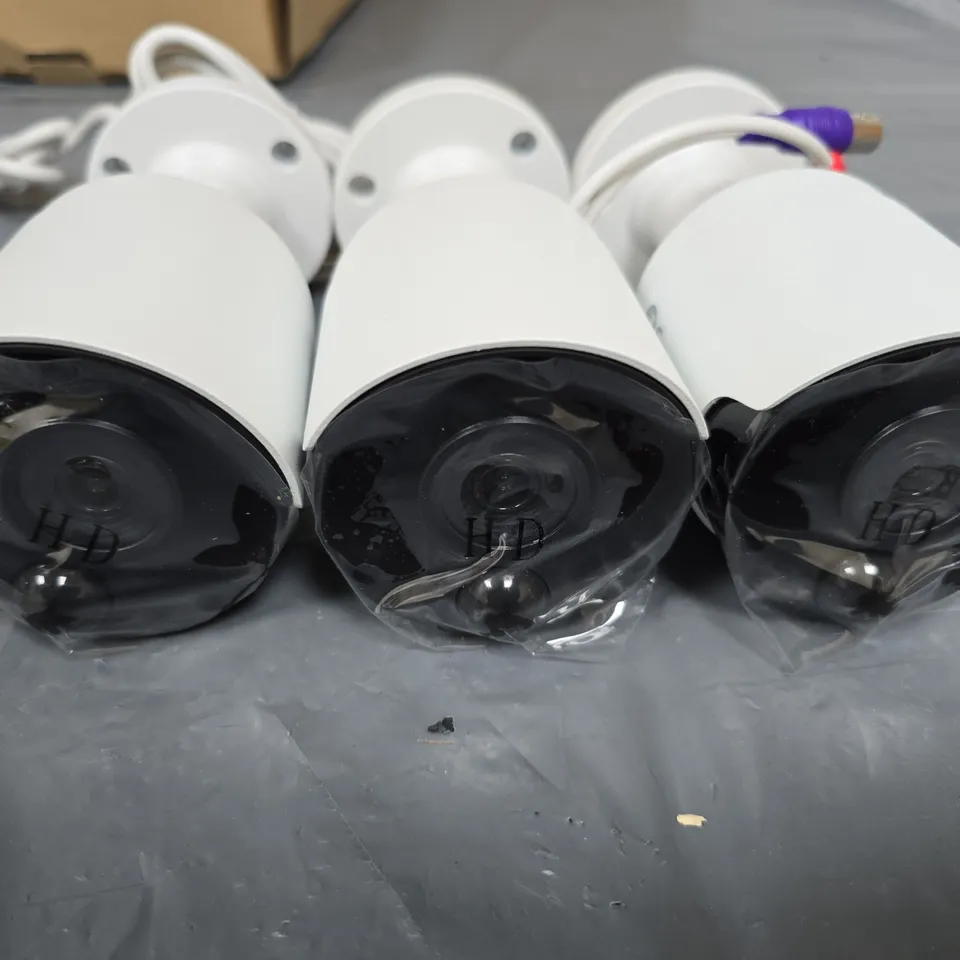 SWANN THREE WHITE BULLET CCTV SURVEILLANCE CAMERAS WITH MOUNTING BASES AND CABLES