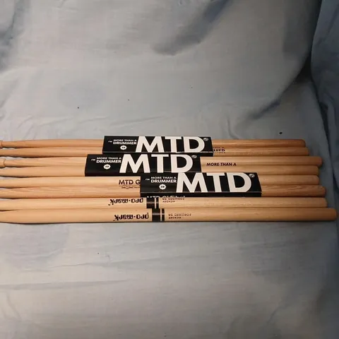 FOUR SETS OF DRUM STICKS TO INCLUDE; PRO-MARK HICKORY FORWARD 5A DRUMSTICKS AND MTD (MORE THAN A DRUMMER) 5B