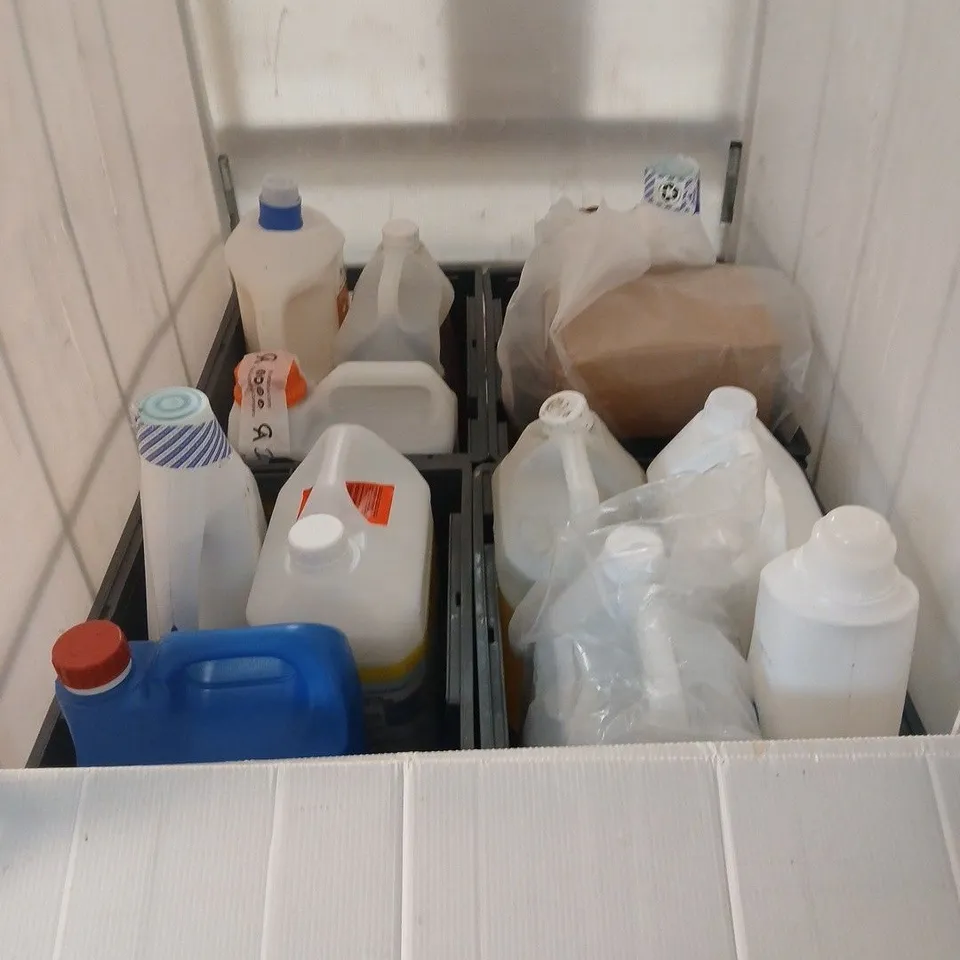 CAGE OF ASSORTED OVERSIZED LIQUIDS