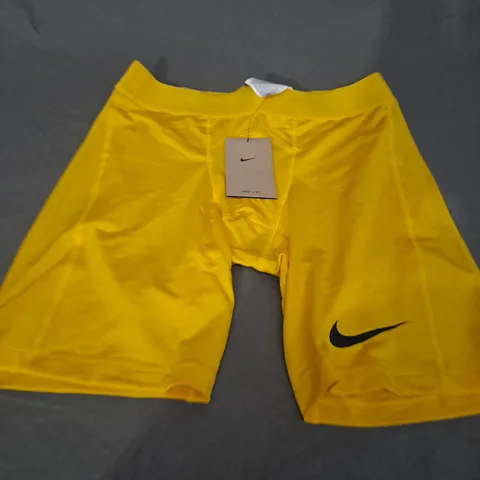 NIKE DRI FIT SHORTS IN YELLOW - SIZE LARGE