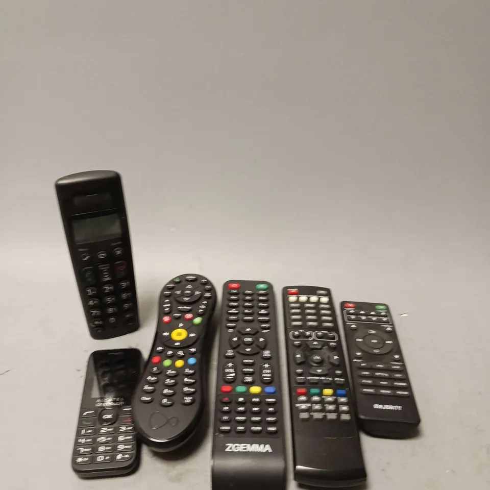 LOT OF 6 ASSORTED REMOTE CONTROLS AND HOME PHONE