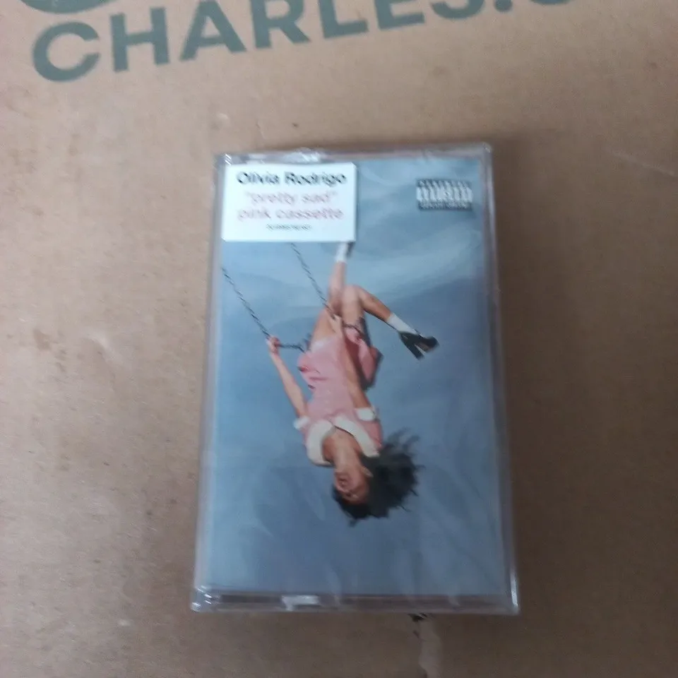 TOTE OF APPROXIMATELY 12 ASSORTED ITEMS TO INCLUDE: OLIVIA RODRIGO PRETTY SAD CASSETTE