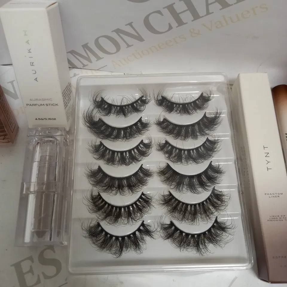 LOT OF APPROX 7 MAKEUP ITEMS TO INCLUDE GLOSSIER LIPGLOSS , TYNT LIQUID LINER , EYELASHES , ETC