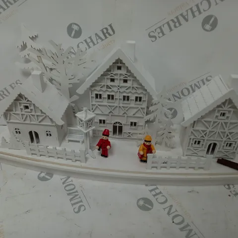 WHITE WOOD LIT VILLAGE SCENE