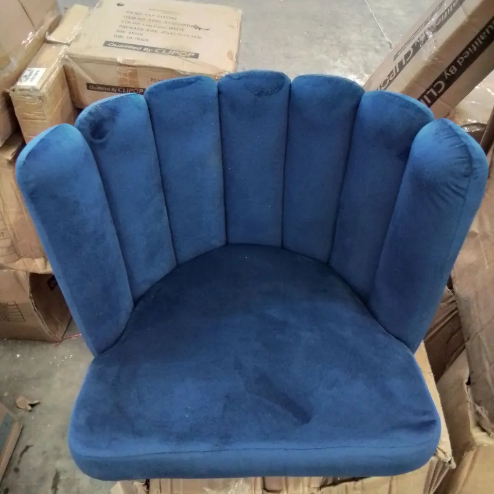A BOXED BLUE VELVET CURVED BACK CHAIR