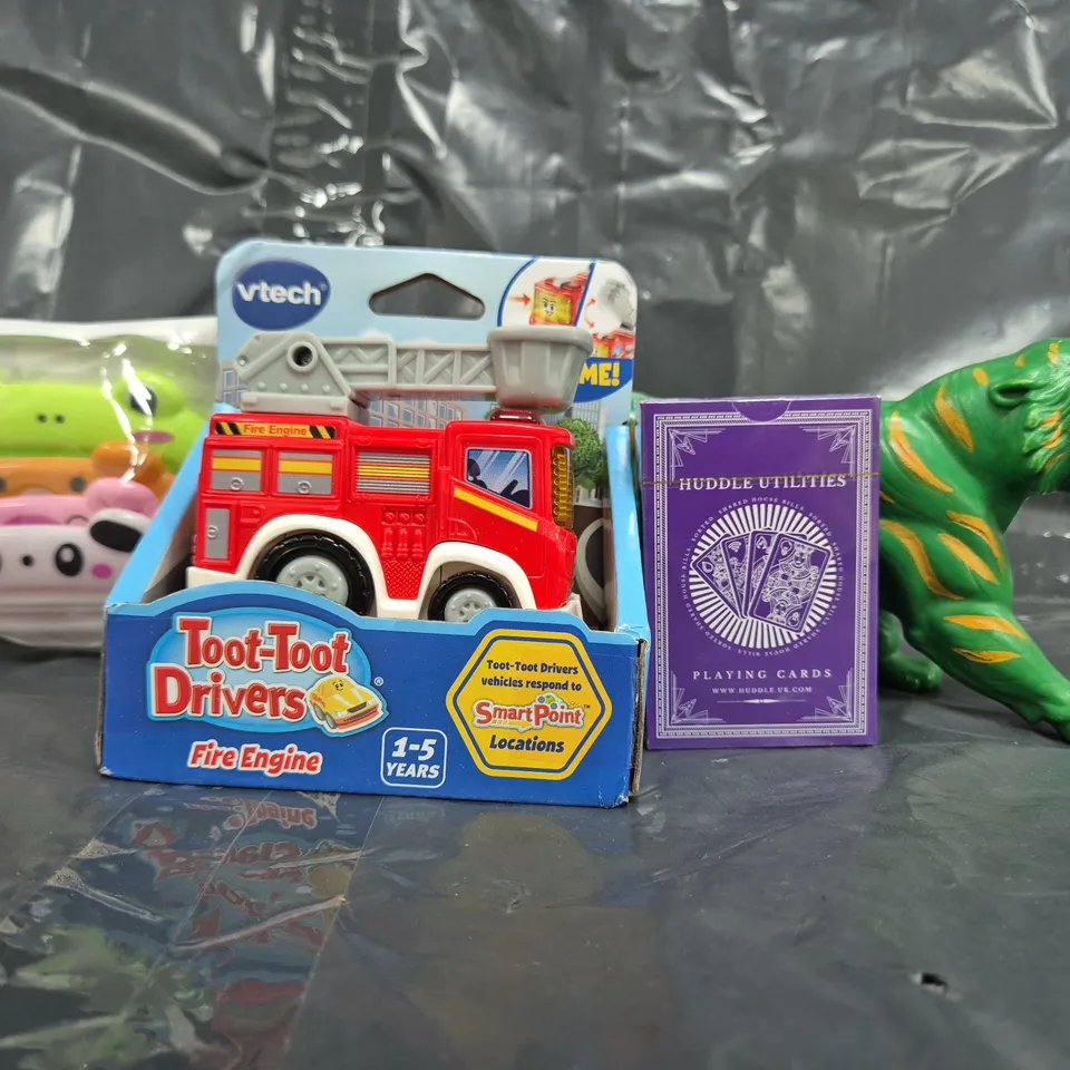 APPROXIMATELY 12 ASSORTED TOYS AND GAMES TO INCLUDE VETCH TOOT-TOOT DRIVERS FIRE ENGINE, PLAYING CARDS, ETC