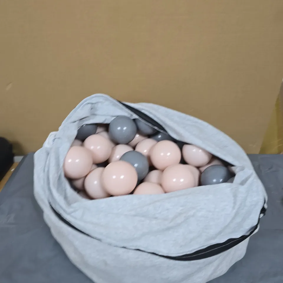PASTEL PINK AND GREY PLAY BALLS IN FABRIC DRAWSTRING BAG