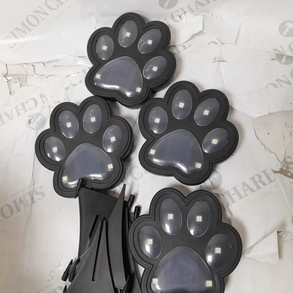 BOXED BELL AND HOWELL SET OF 4 SOLAR PAW LIGHTS