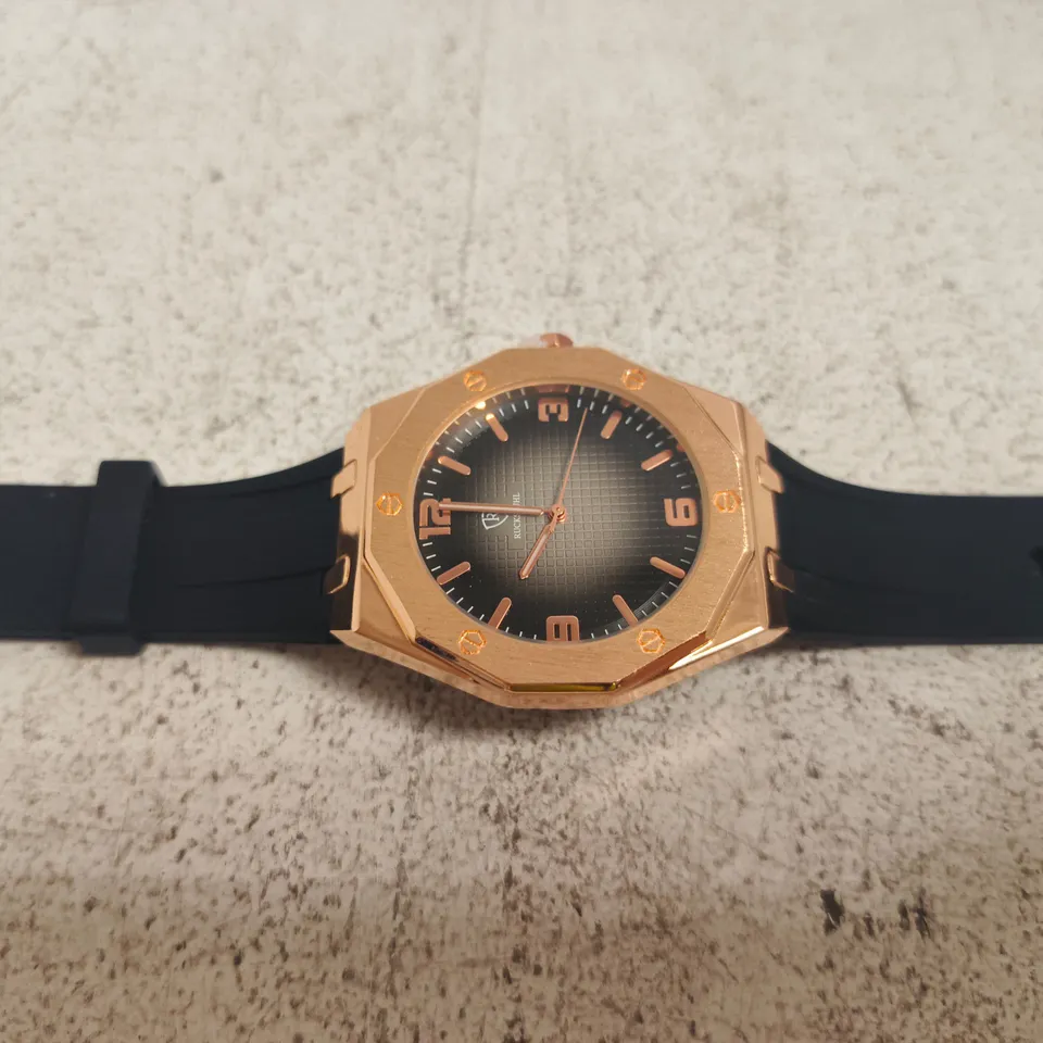 RUCKSTUHL ROSE GOLD-TONE WRISTWATCH – BLACK DIAL, RUBBER STRAP