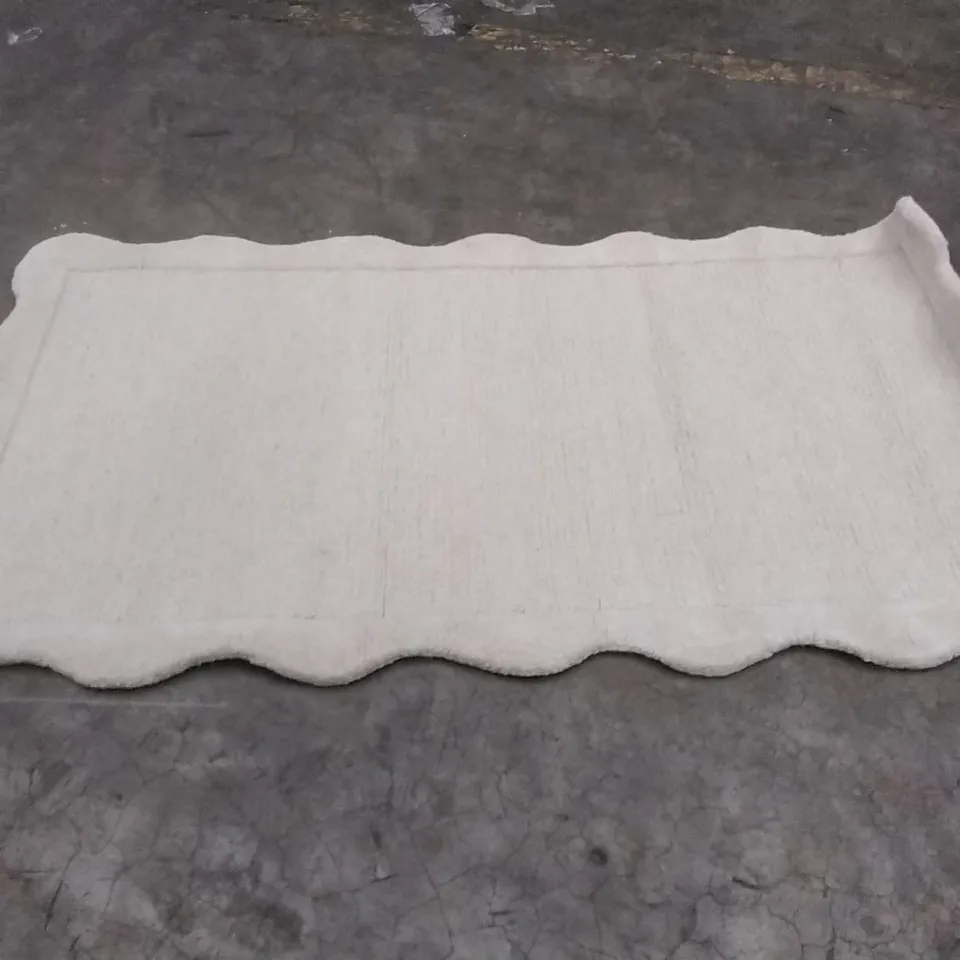 STILLAGE OF APPROXIMATELY 20 DESIGNER RUGS